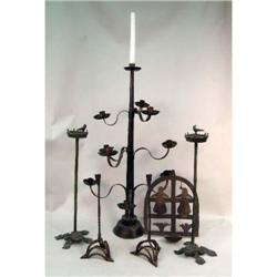 A GROUP OF SEVEN MEXICAN WROUGHT IRON AND TIN CANDLE HOLDERS