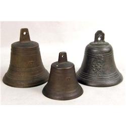 THREE BRONZE BELLS OF VARYING SIZES