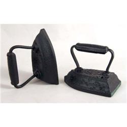 TWO CAST-IRON "SAD IRON" DOORSTOPS