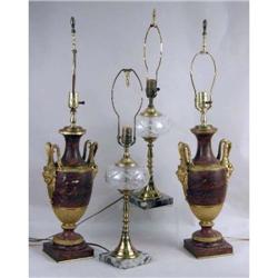 A PAIR OF LOUIS XVI STYLE GILT METAL MOUNTED URN FORM RED STONE URNS