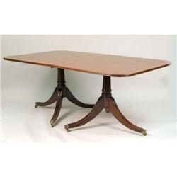 A GEORGIAN STYLE TWIN PEDESTAL MAHOGANY DINING TABLE