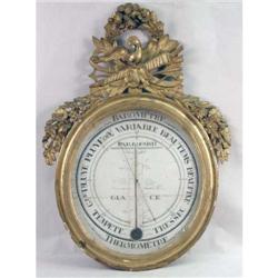 A LOUIS XVI STYLE CARVED GILT WOOD CIRCULAR WALL MOUNTED DIAL BAROMETER