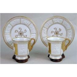 A PAIR OF CAPO-DI-MONTE PORCELAIN CABINET CUPS AND SAUCERS