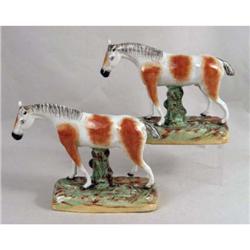 A PAIR OF ENGLISH STAFFORDSHIRE HORSE FIGURALS