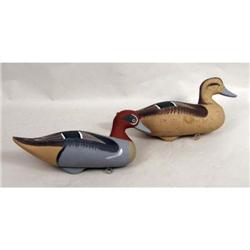 A PAIR OF CARVED AND PAINTED WOOD DUCK DECOYS