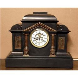 A CLASSICAL REVIVAL STONE MANTLE CLOCK