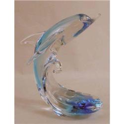 A BLUE GLASS SCULPTURE OF A DOLPHIN