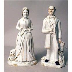 A PAIR OF PARCEL-GILT PORCELAIN DECORATED FIGURES