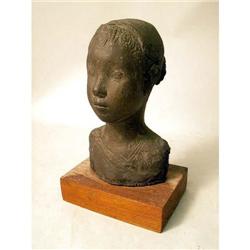A CAST BRONZE SCULPTURE