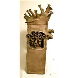 A BROWN-GLAZED REDWARE ABSTRACT SCULPTURE