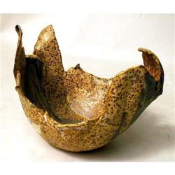 A SPECKLED GLAZED FREE FORM REDWARE BOWL