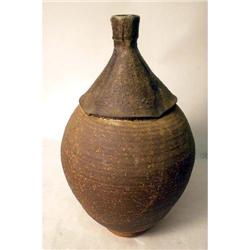 A BROWN GLAZED REDWARE VASE