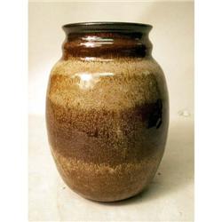 A BROWN AND IVORY GLAZED REDWARE OVOID VASE
