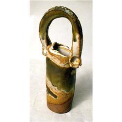 A GREEN AND WHITE GLAZED REDWARE BUD VASE