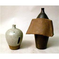 A GLAZED REDWARE "DRAPED" BOTTLE