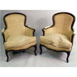 A PAIR OF LOUIS XV-STYLE CARVED WALNUT BERGERES