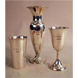 AN INTERNATIONAL WEIGHTED STERLING SILVER TROPHY VASE