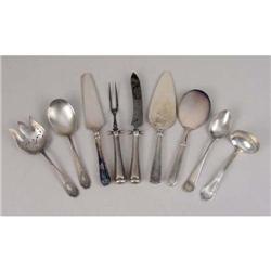 A GROUP OF NINE STERLING SILVER AND STERLING SILVER HANDLED SERVING PIECES
