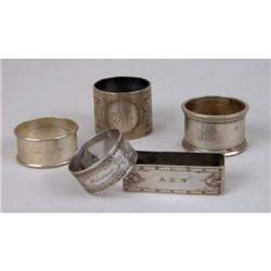 FOUR STERLING SILVER NAPKIN RINGS
