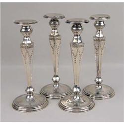 A SET OF FOUR LEBKUECHER & CO, NEWARK, NJ STERLING SILVER VASIFORM WEIGHTED CANDLESTICKS