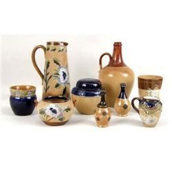 A GROUP OF NINE DOULTON LAMBETH POTTERY ITEMS