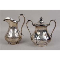 AN AMERICAN SILVER CREAM JUG