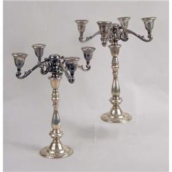 A PAIR OF INTERNATIONAL WEIGHTED STERLING SILVER CANDLESTICKS WITH DETACHABLE FOUR-BRANCH CANDELABRA
