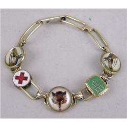 A CRYSTAL AND GOLD PLATED HUNT THEME KREMENTZ BRACELET