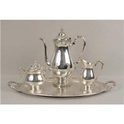 AN INTERNATIONAL SILVER "CAMILLE" PATTERN SILVER PLATED THREE PIECE COFFEE SERVICE ON MATCHING DOUBL