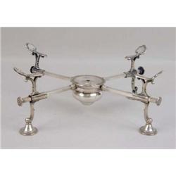 A SILVER ON COPPER DISH CROSS