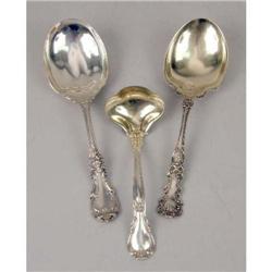A GROUP OF THREE STERLING SILVER SERVING SPOONS