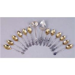 A SET OF TWELVE REED & BARTON FLORAL TERMINAL DEMI-TASSE SPOONS