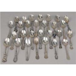 A GROUP OF TWENTY EIGHT STERLING SILVER SOUVENIR TEASPOONS AND COFFEE SPOONS