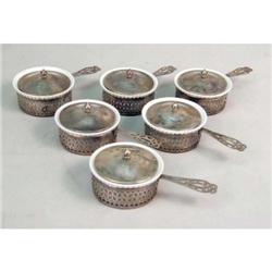 A BOXED SET OF TWELVE STERLING SILVER MONOGRAMMED RAMEKIN HOLDERS AND LIDS