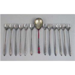 A SET OF TWELVE  J.E. CALDWELL STERLING SILVER COCKTAIL FORKS