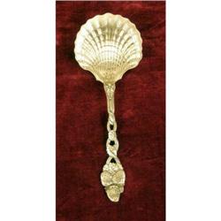 A TIFFANY & CO STERLING SILVER BERRY PATTERN SHELL-FORM BOWL SERVING SPOON