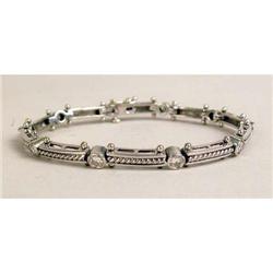A 14K WHITE GOLD AND DIAMOND BRACELET
