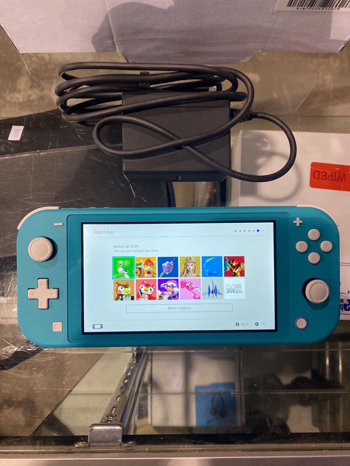NINTENDO SWITCH LITE WITH CHARGER TURNS ON Able Auctions