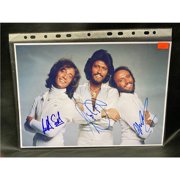 THE BEE GEES SIGNED PHOTO WITH COA AUTOGRAPHS INCLUDE:  BARRY GIBB, ROBIN GIBB, MAURICE GIBB