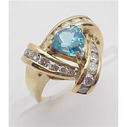 Lady's blue topaz and diamond ring