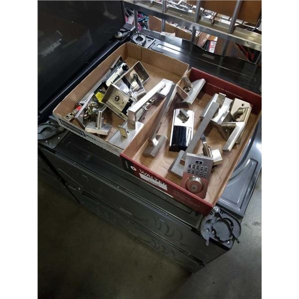 2 trays of Weiser door parts