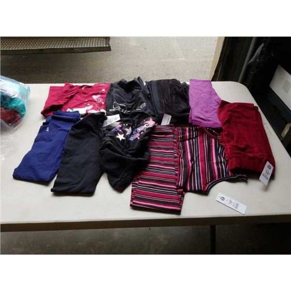 Lot of brand new L (8-9yrs) clothing