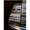 Image 4 : Large trays of DVDs and DVD sets