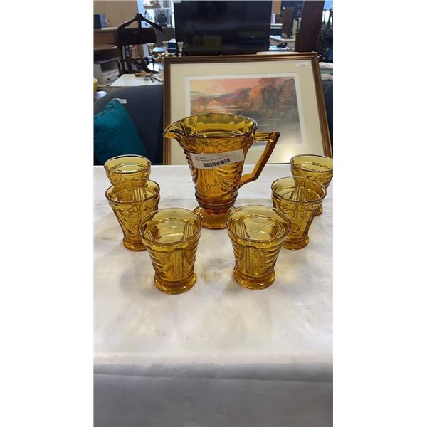 Amber depression glass jug and 6 cups