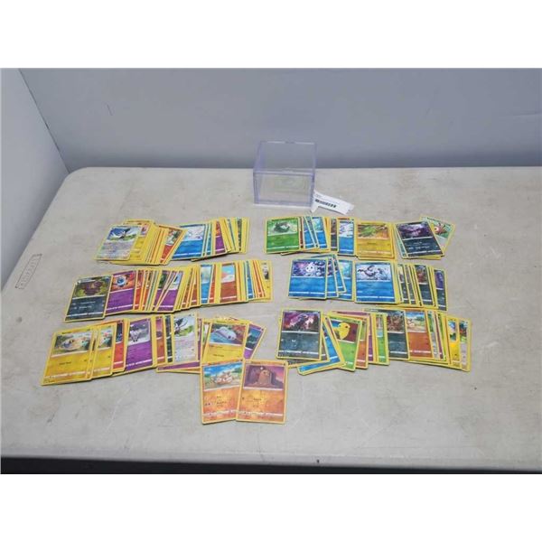 150 COMMON REVERSE HOLOGRAPHIC POKEMON CARDS AND HARD CASE