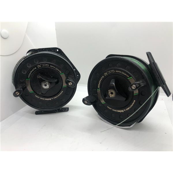 Two Daiwa DC375 salmon mooching reels w/ depth counters