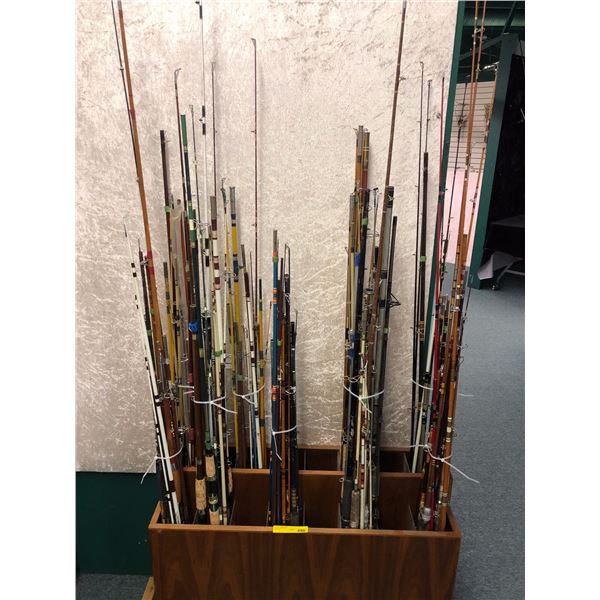 Group of 90 assorted fishing rods (wooden rod display stand not included)