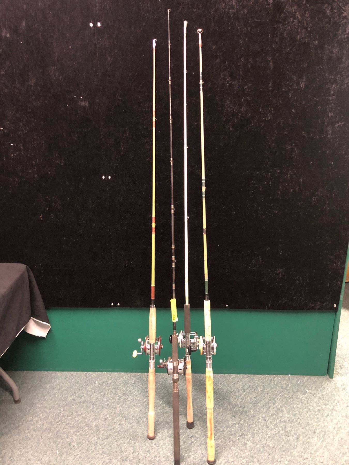 Group of 4 assorted halibut/trolling rods complete with level wind reels