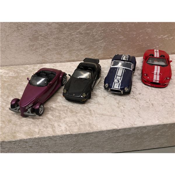 Group of 4 die cast metal collector's sports cars