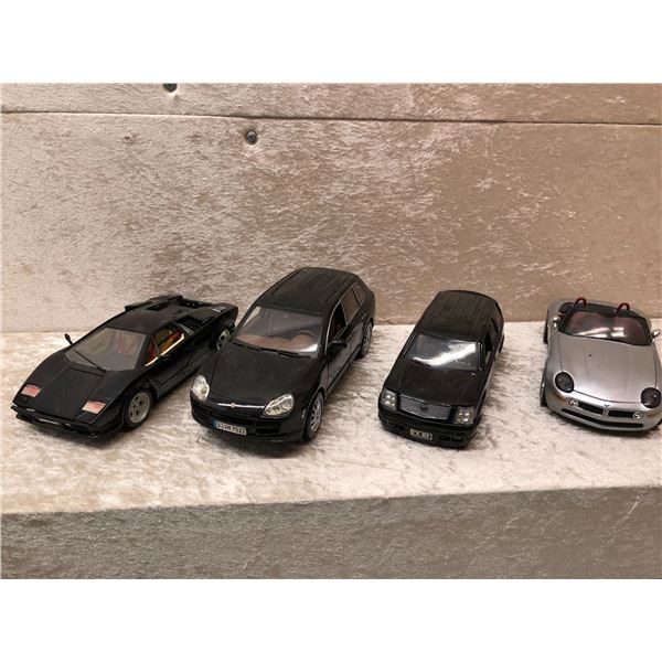 Group of 4 die cast metal sports cars & SUVs